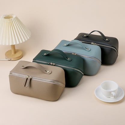 Four color options of the cowhide cosmetic pouch displayed together