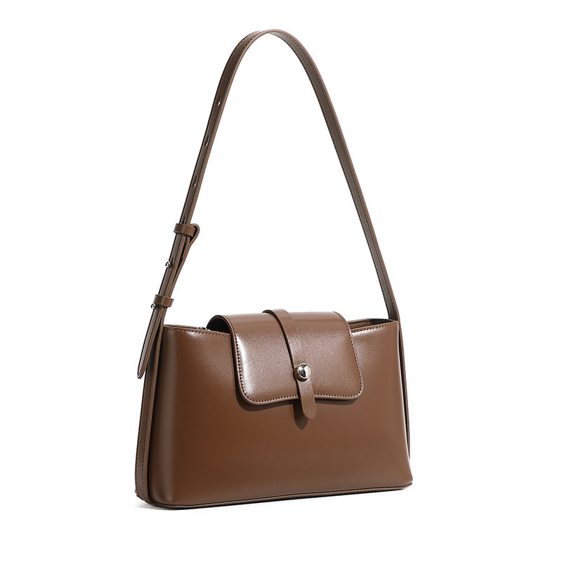 Caramel leather shoulder bag on white background