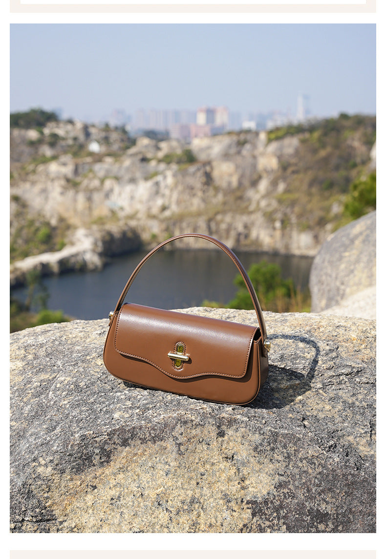 Carrying the baguette bag by top handle in lifestyle photo