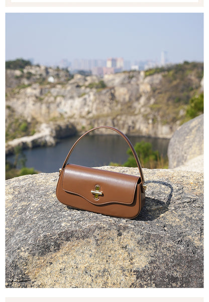 Carrying the baguette bag by top handle in lifestyle photo