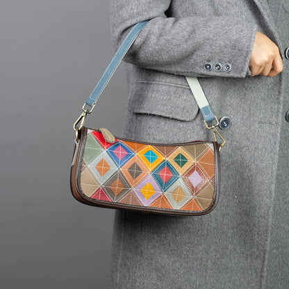 Multicolor patchwork shoulder bag shown worn against a coat