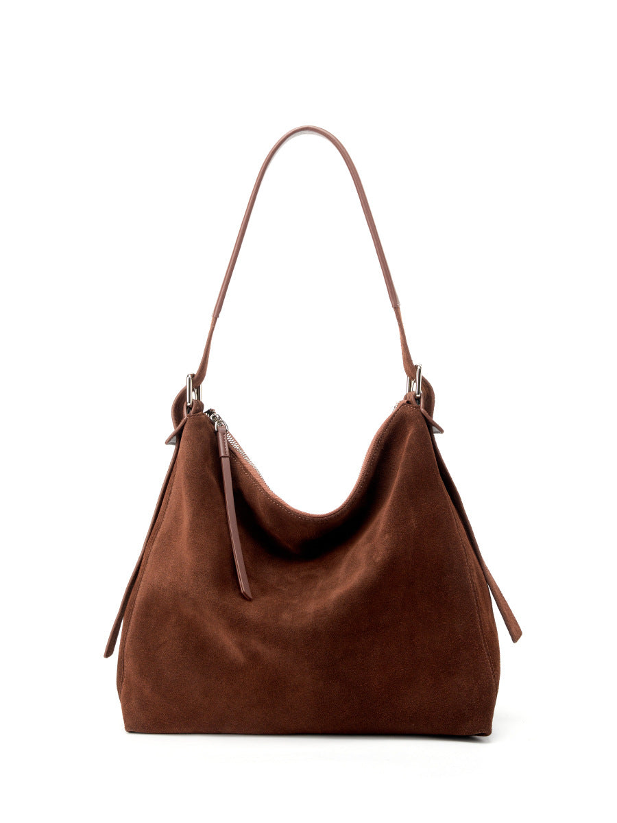 Brown shoulder tote photographed at an angled front view