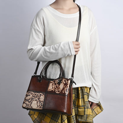 Model carrying a brown top-grain cowhide bag with embossed floral patchwork