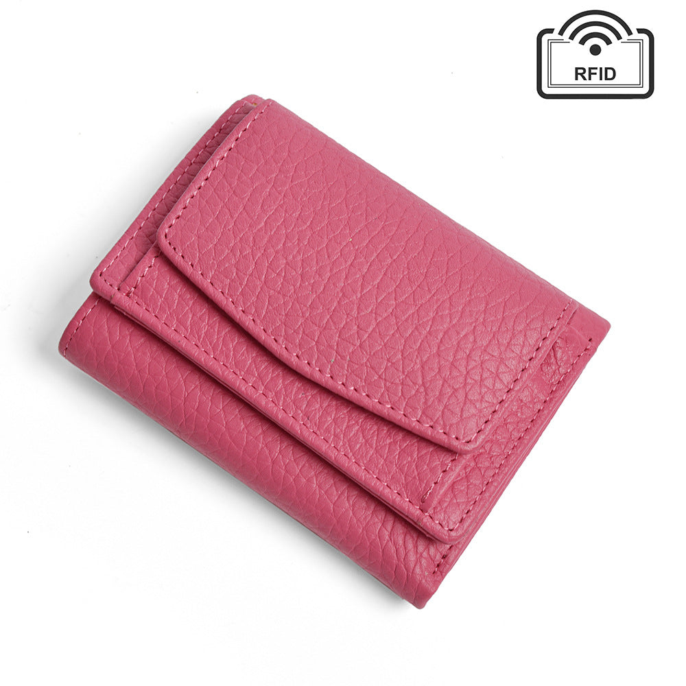 Bright pink tri-fold wallet with textured surface