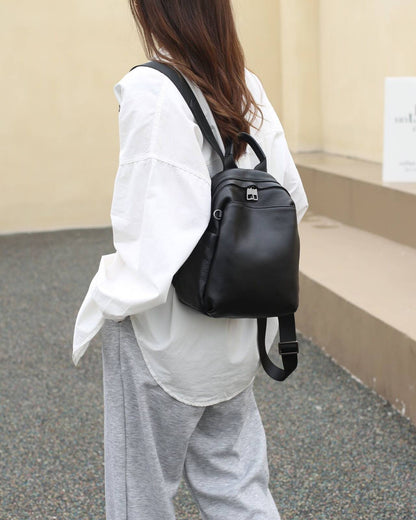Black pebbled cowhide backpack worn on the back
