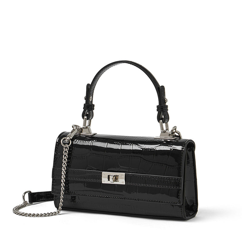 Black croco-embossed cowhide leather envelope crossbody bag, front view on white background