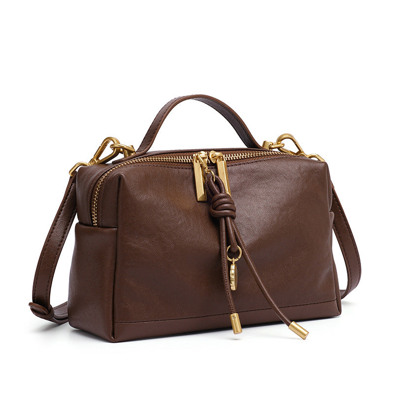 Brown cowhide leather mini bag with gold-tone metal zipper detail