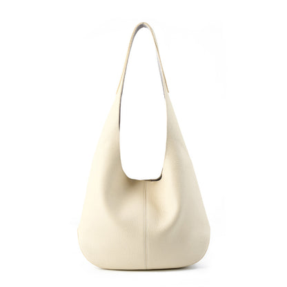 Off-white cowhide leather bucket tote bag on white background