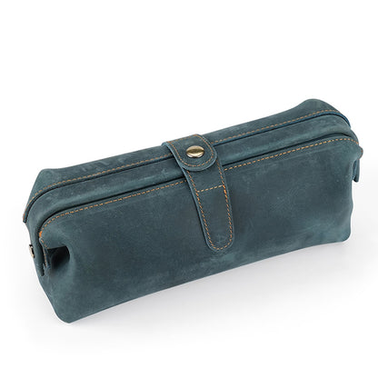 Blue cowhide pouch showing its long rectangular shape