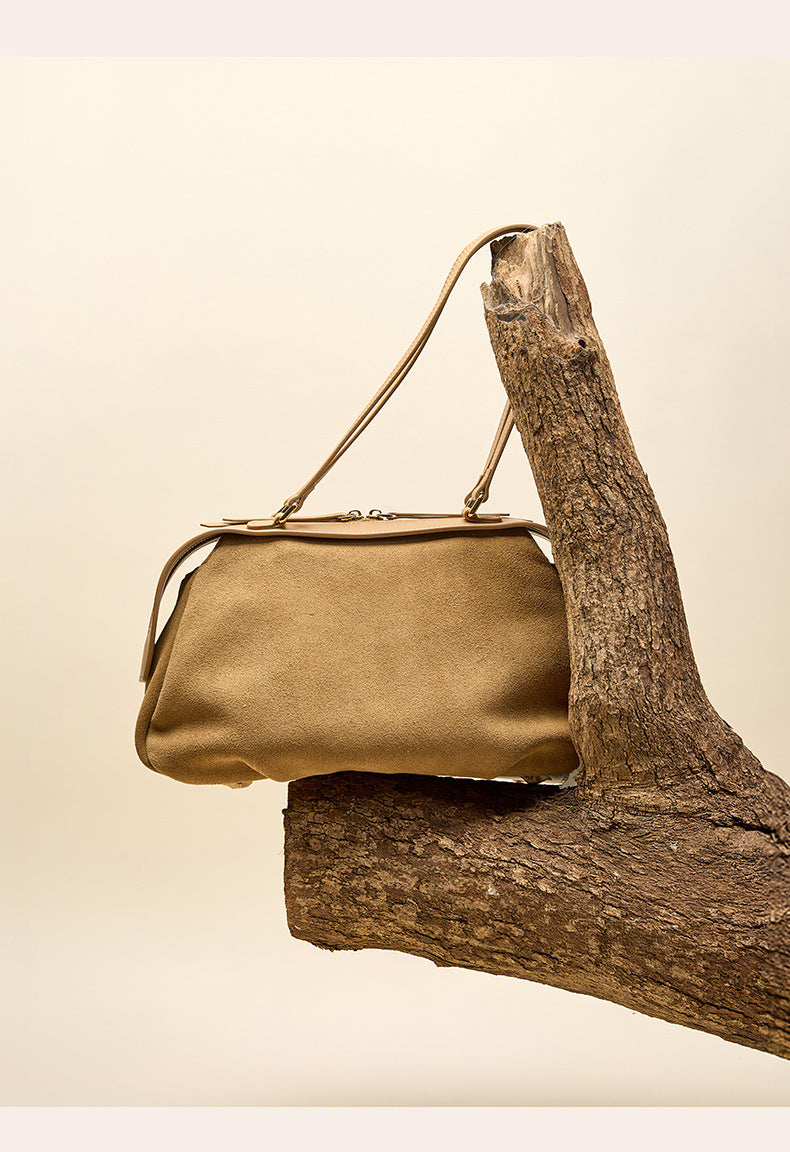 Coffee shoulder bag shown at an angled side view