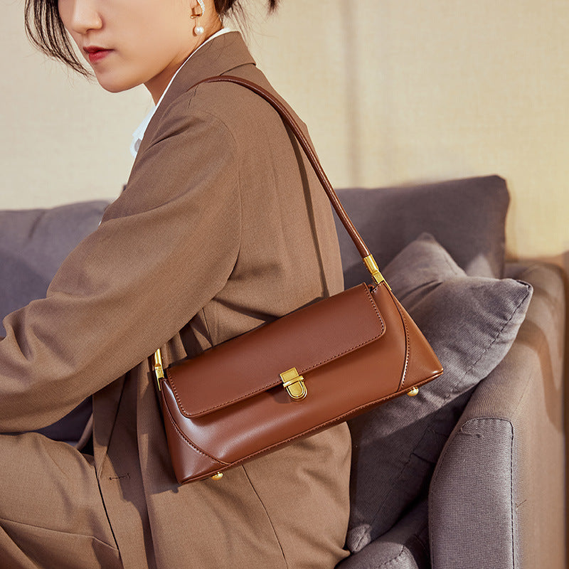 Coffee baguette shoulder bag styled with tailored outfit