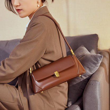Coffee baguette shoulder bag styled with tailored outfit