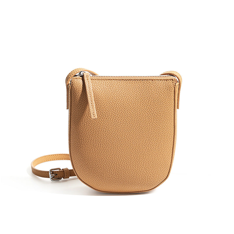 Biscuit cowhide leather mini crossbody phone bag with adjustable strap on white background
