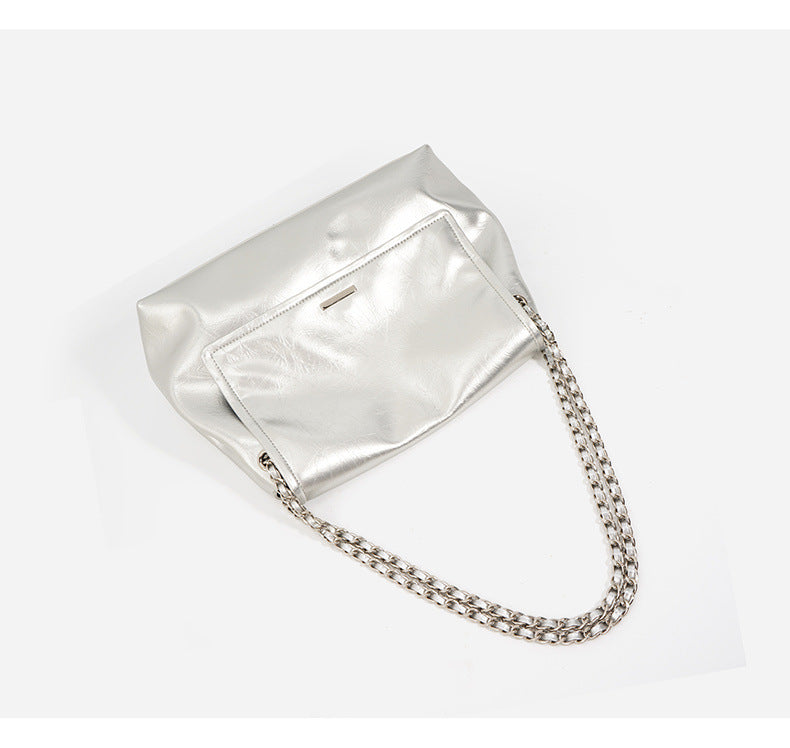 Top-down view of silver cowhide leather chain shoulder bag showing chain strap detail
