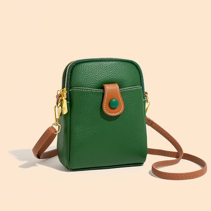 Front view of green pebbled cowhide small bag with gold-tone hardware and snap tab