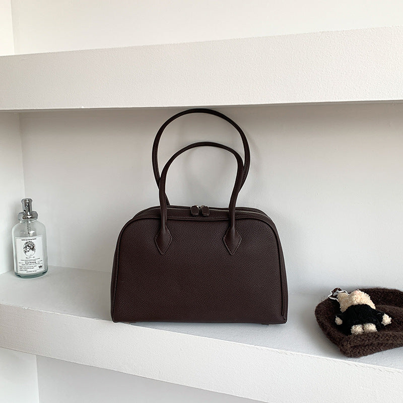 Coffee brown Boston bag with long shoulder handles and zip top