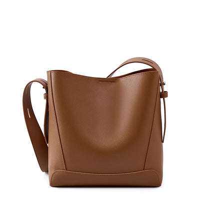 Golden Brown leather bucket bag on white background
