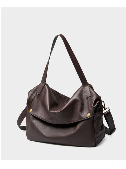 Front view of coffee brown pebbled leather tote with foldover flap and top handles