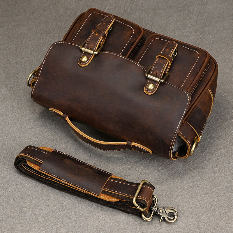 Angled overhead view of camera bag and shoulder strap