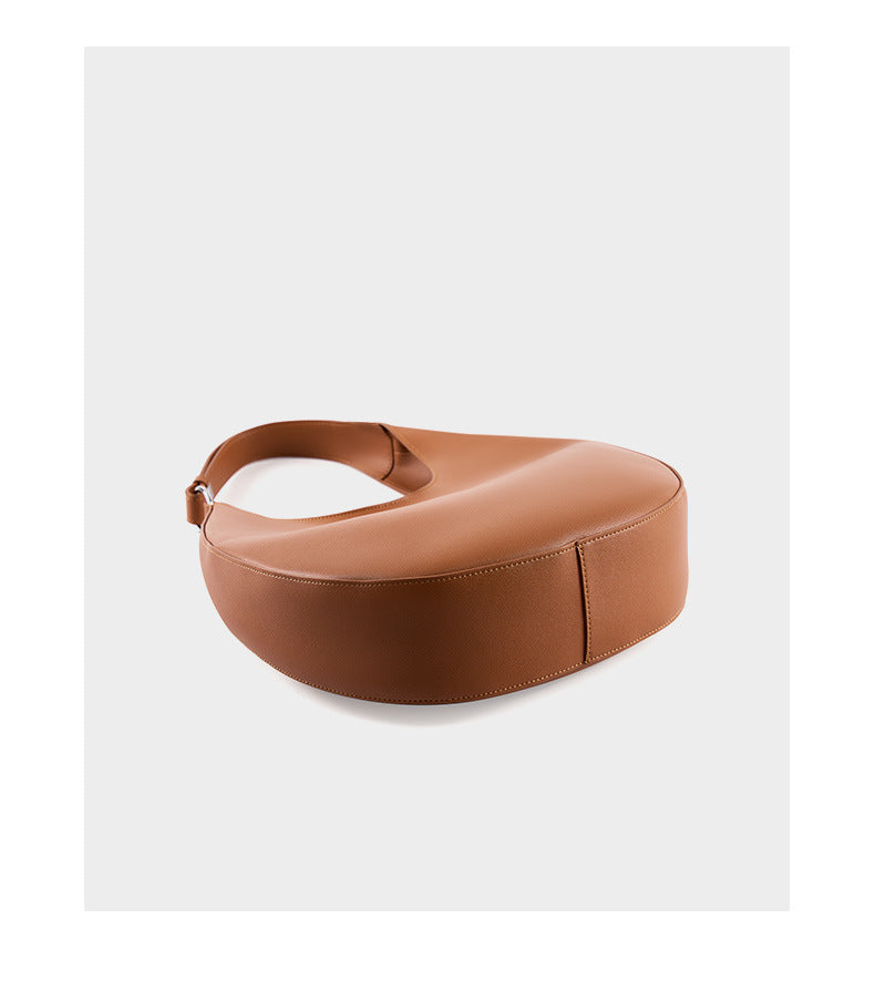 Top-down view of light brown crescent hobo bag showing crescent silhouette