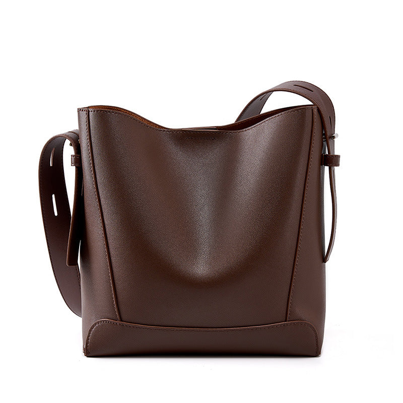 Coffee leather bucket bag on white background