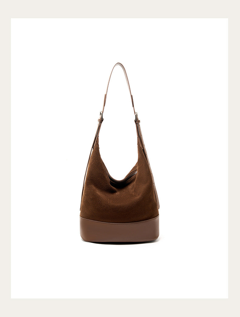 Front view of the coffee bucket shoulder bag on a light background