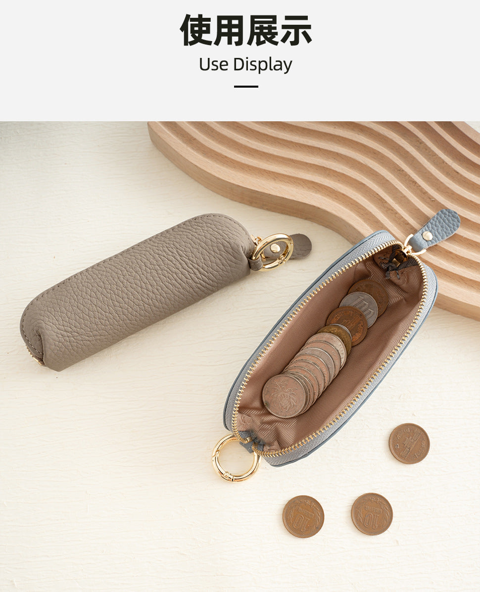 Mini zip pouch styled with coins on a wooden surface