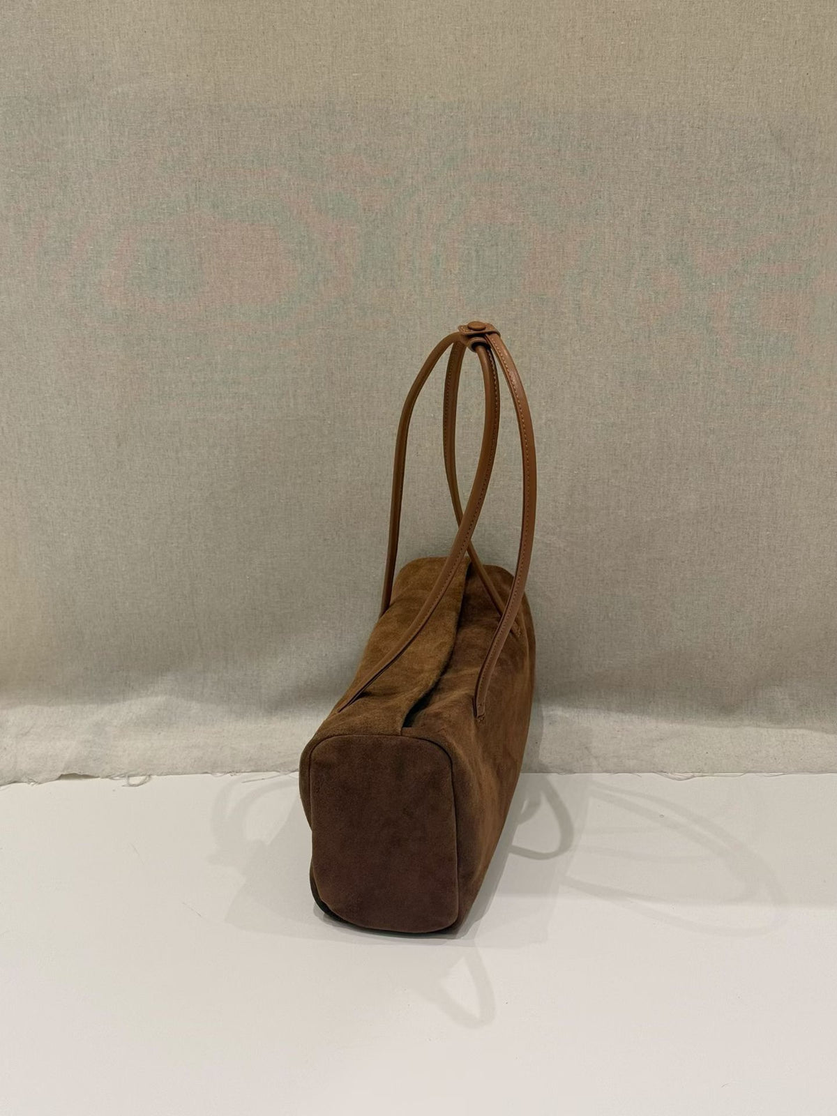 Coffee nubuck tote photographed from underneath
