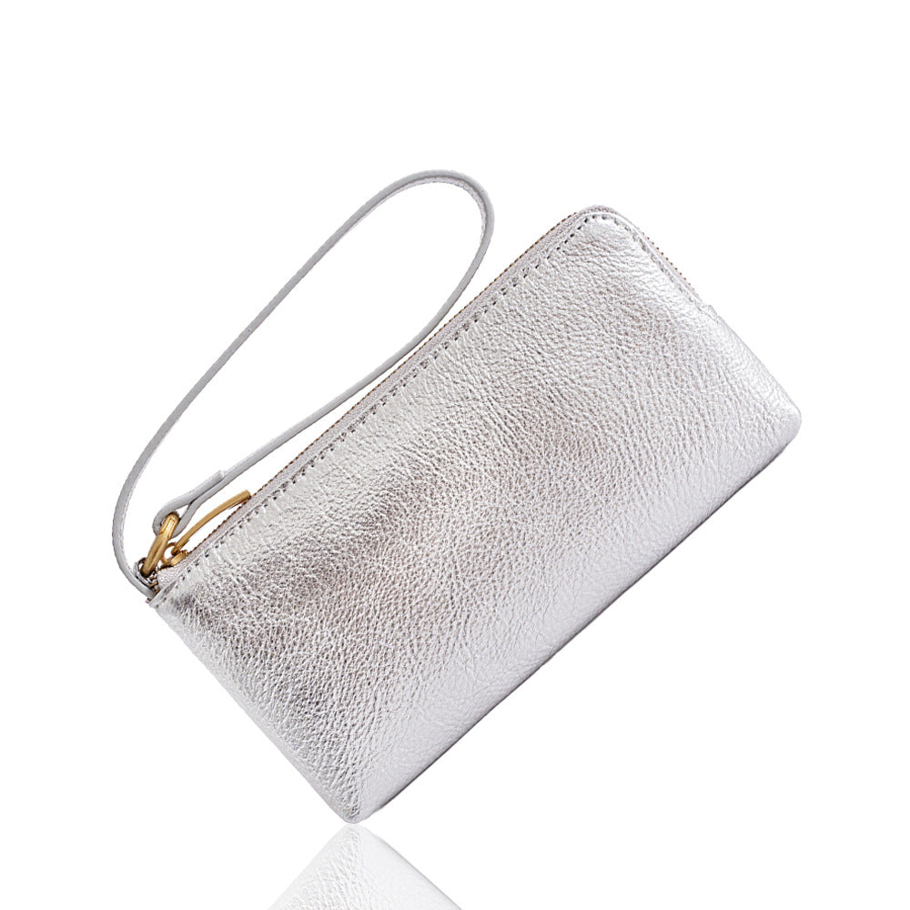 Silver pebble-grain cowhide leather long wallet with wrist strap shown at angle