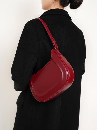 Back view of wine red leather shoulder bag on model
