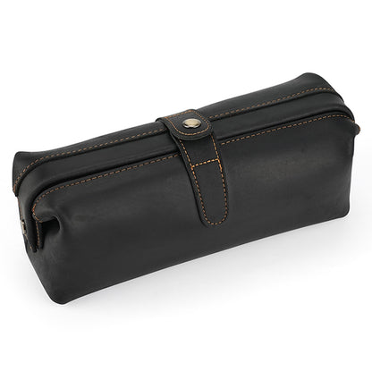 Black leather cosmetic pouch with stitched snap tab