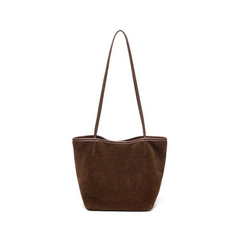 Front view of solid coffee suede bucket tote