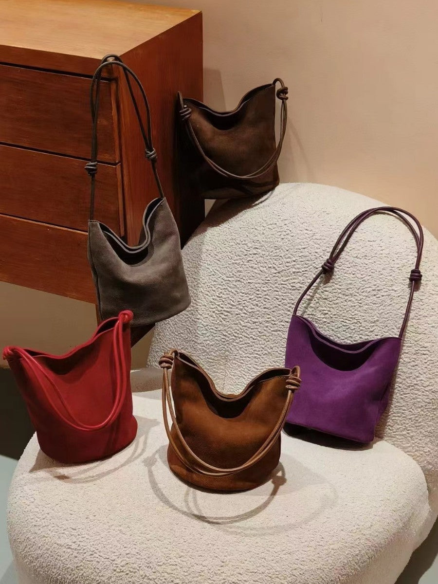 Bucket bags in several colors arranged together