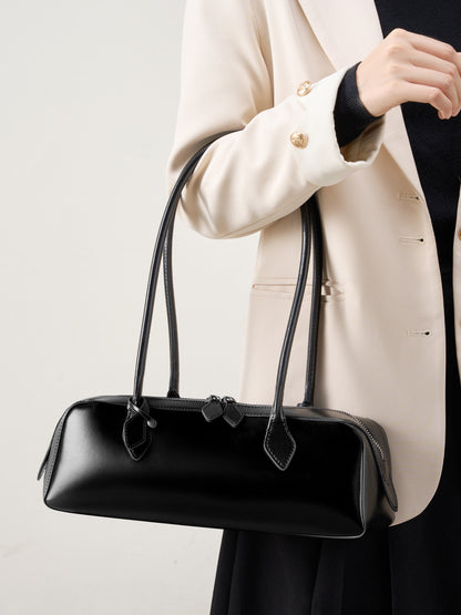 Black leather baguette bag shoulder strap and keeper tab