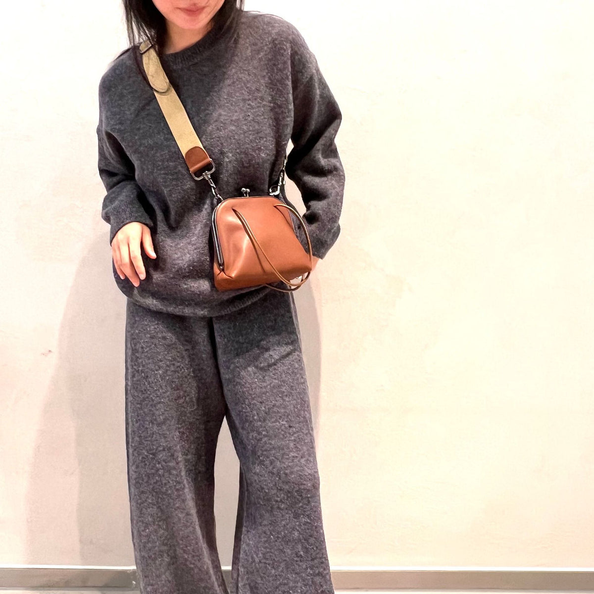 Coffee frame bag worn in front with shoulder strap