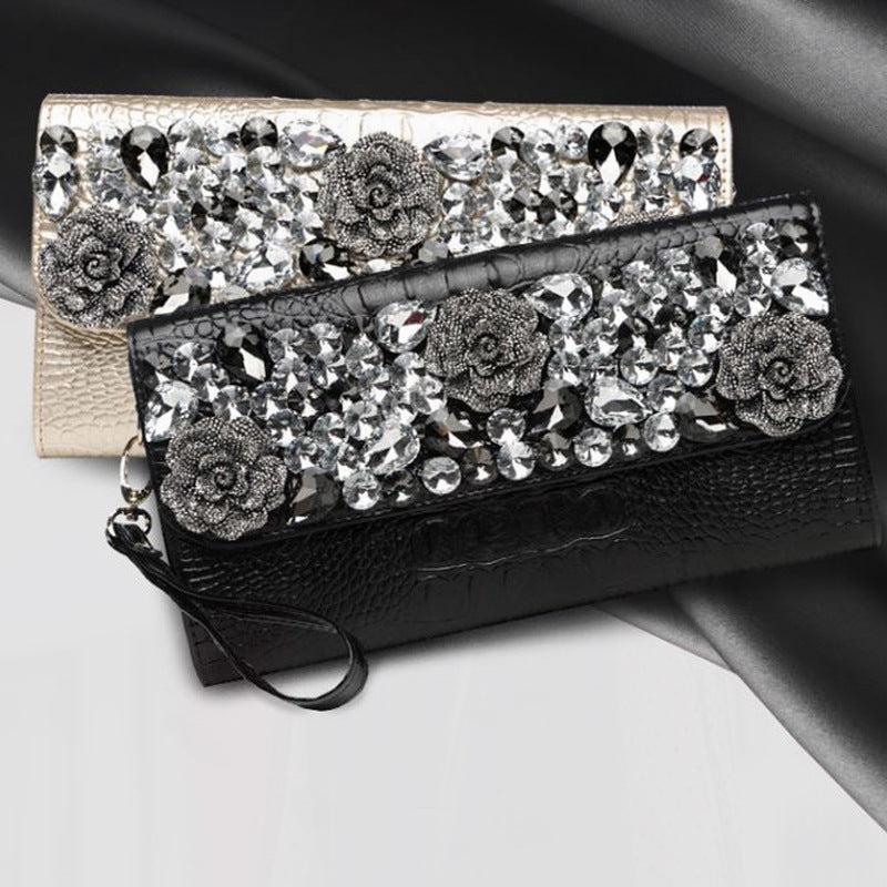 Black and light gold envelope clutches with embellished floral flaps