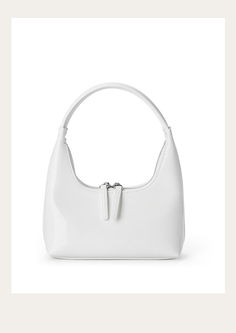Cream patent cowhide mini hobo bag, front view on white background