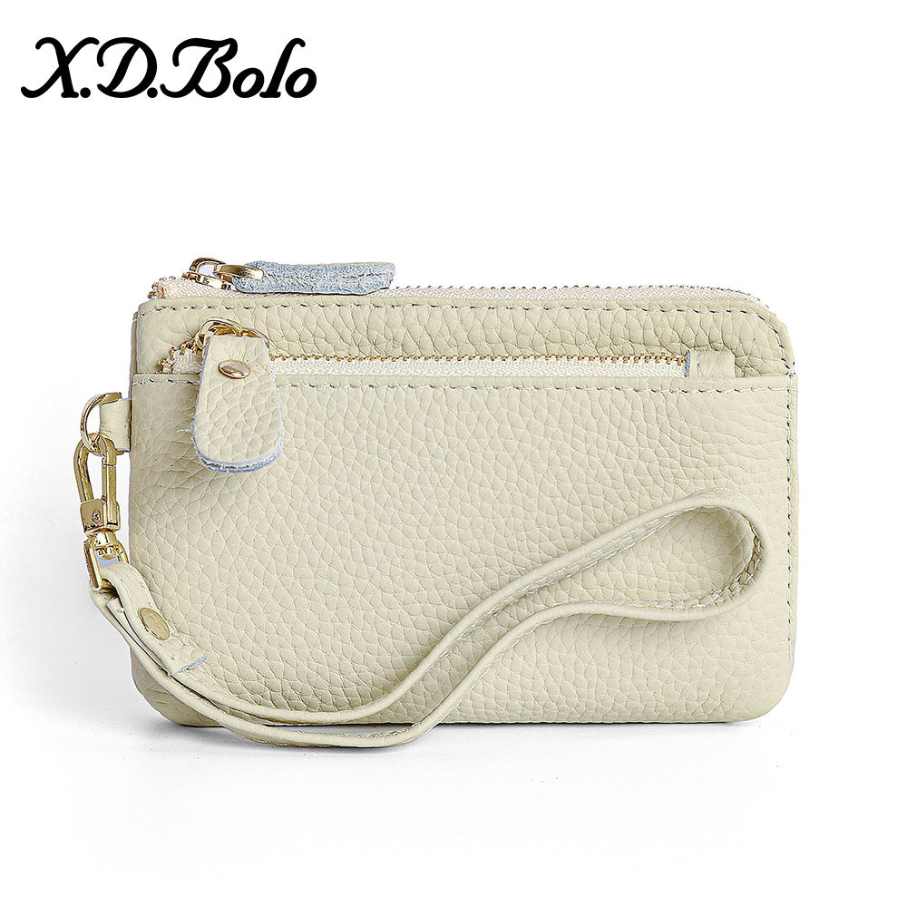 Genuine leather mini zip clutch wallet in white on neutral background