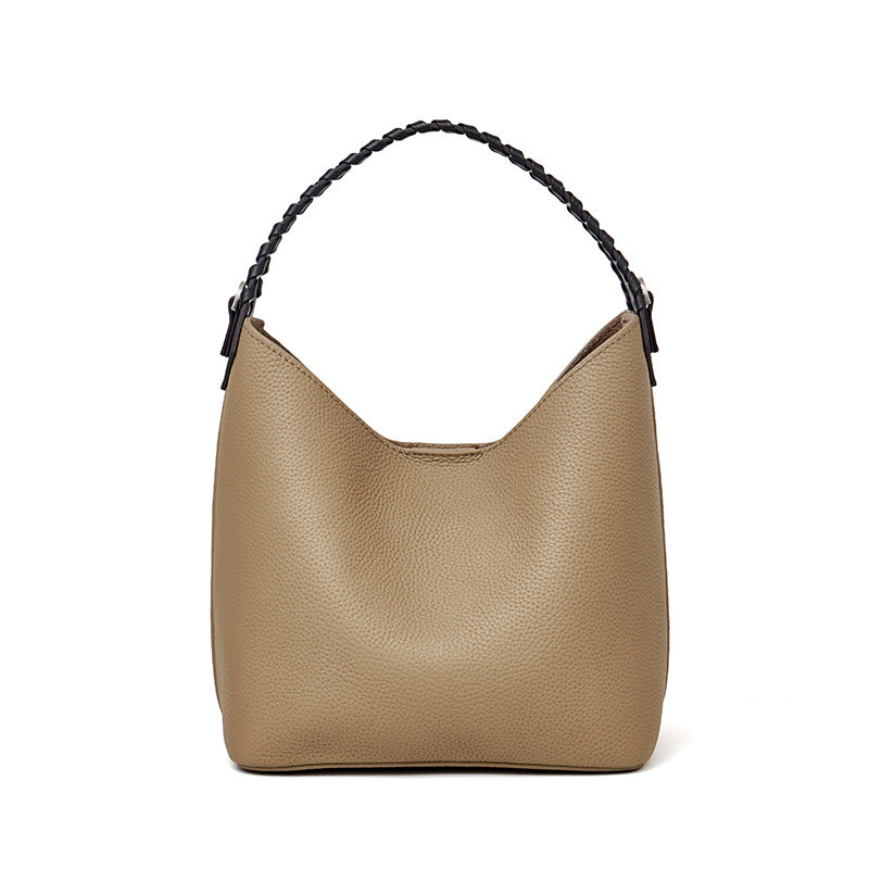 Grey top-grain cowhide leather bucket bag with braided top handle, front view