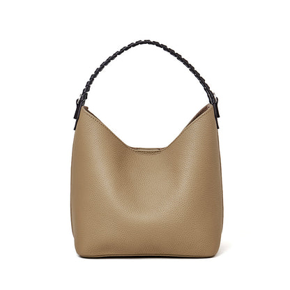 Grey top-grain cowhide leather bucket bag with braided top handle, front view