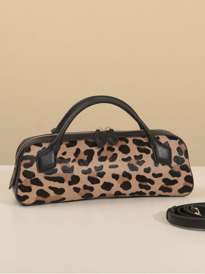 Front-facing leopard-print bag with detachable strap beside it