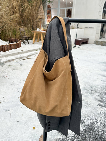 Caramel leather shoulder tote shown from the side