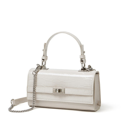 Cream white croco-embossed cowhide leather envelope crossbody bag, front view on white background