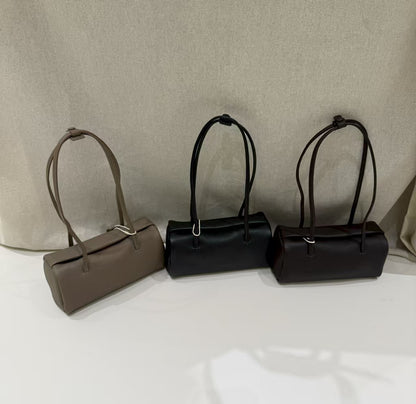 Close view of the bag straps and stitched attachment points