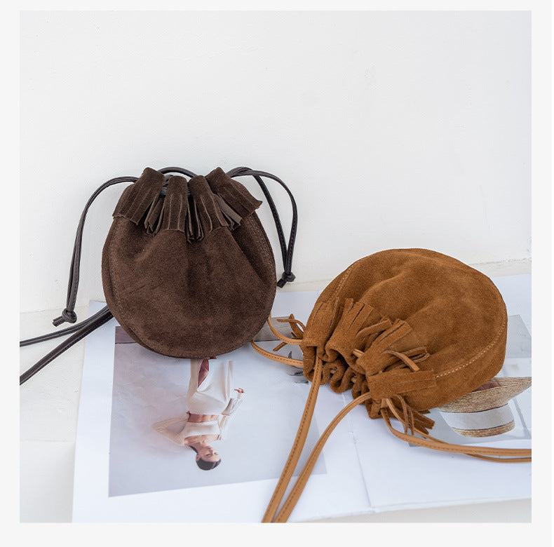 Rounded bucket bag shape shown from a side angle