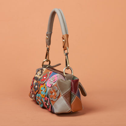 Front view of colorful leather bag with raised flower appliques