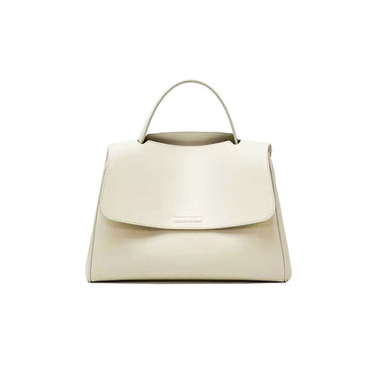 White cowhide leather top-handle bag with flap closure on white background