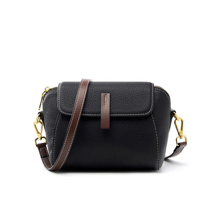Black top-grain cowhide shell crossbody bag with brown leather pull tab and gold-tone hardware