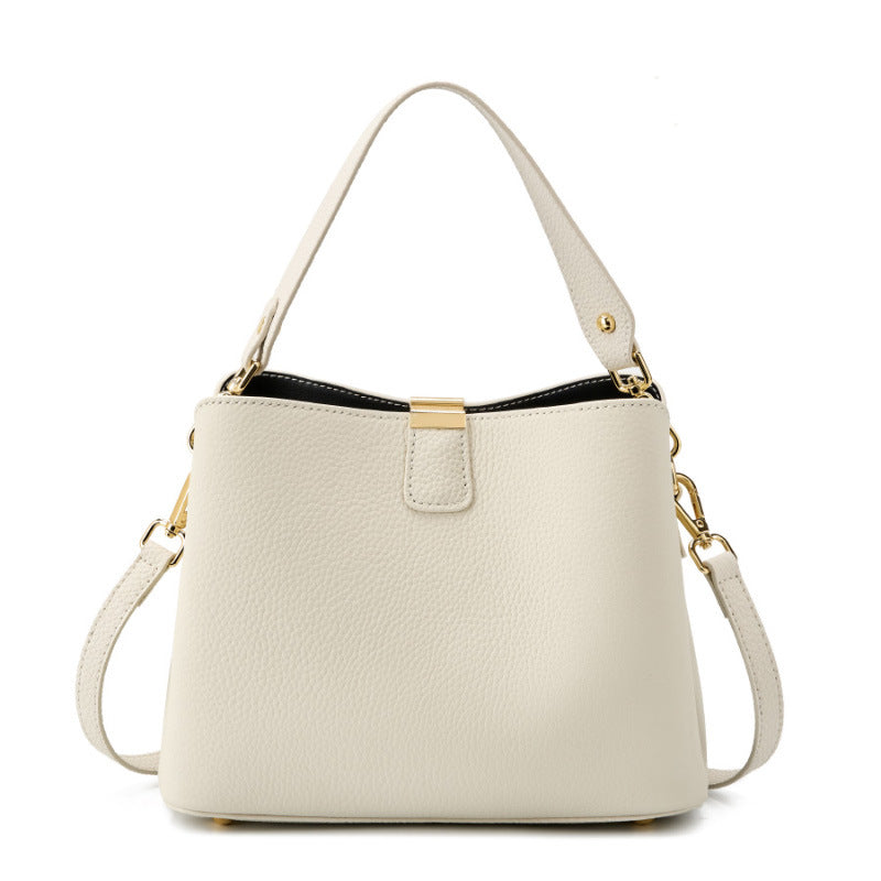 Off-white pebbled leather bucket bag on white background