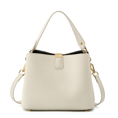 Off-white pebbled leather bucket bag on white background